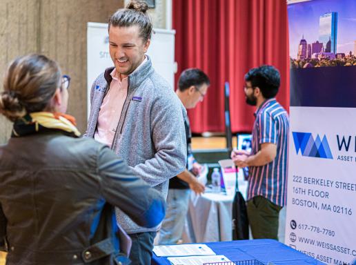 Student talking to a recruiter at a Career Fair